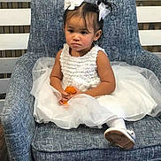 Blessing is registered to the contest to win money with this photo: chair, child, clothing, couch, cushion, dress, face, female, furniture, girl, happy, head, homedecor, laughing, pants, person, photography, portrait, sitting, smile