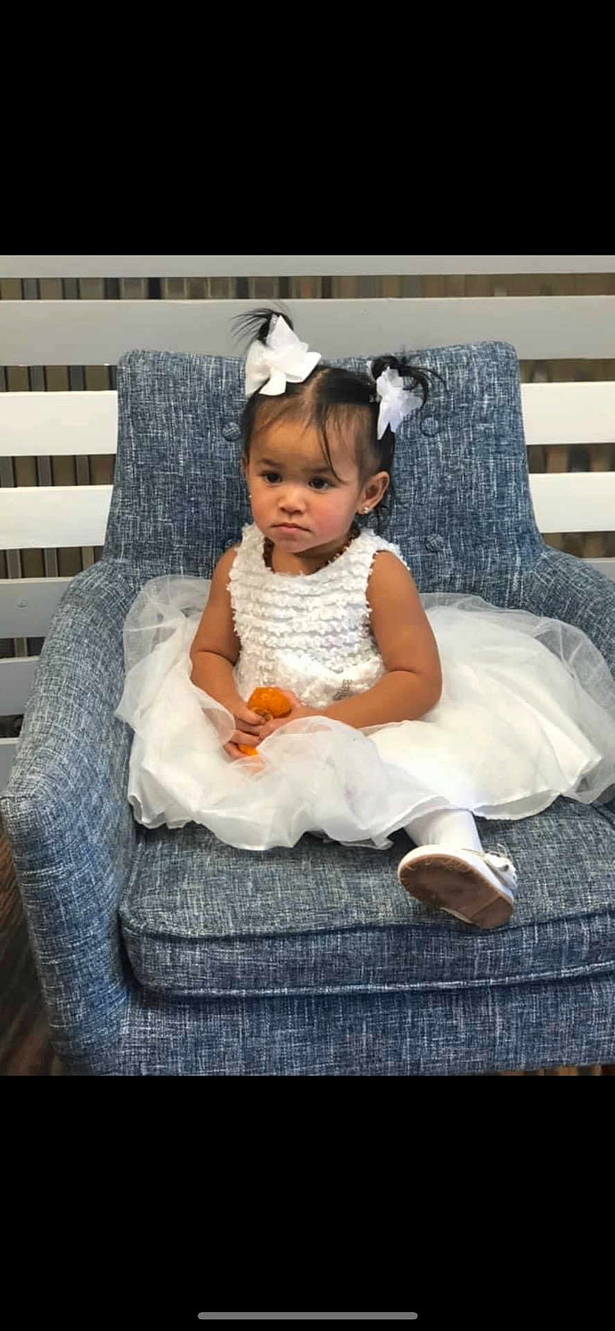 Blessing is registered to the contest to win money with this photo: chair, child, clothing, couch, cushion, dress, face, female, furniture, girl, happy, head, homedecor, laughing, pants, person, photography, portrait, sitting, smile