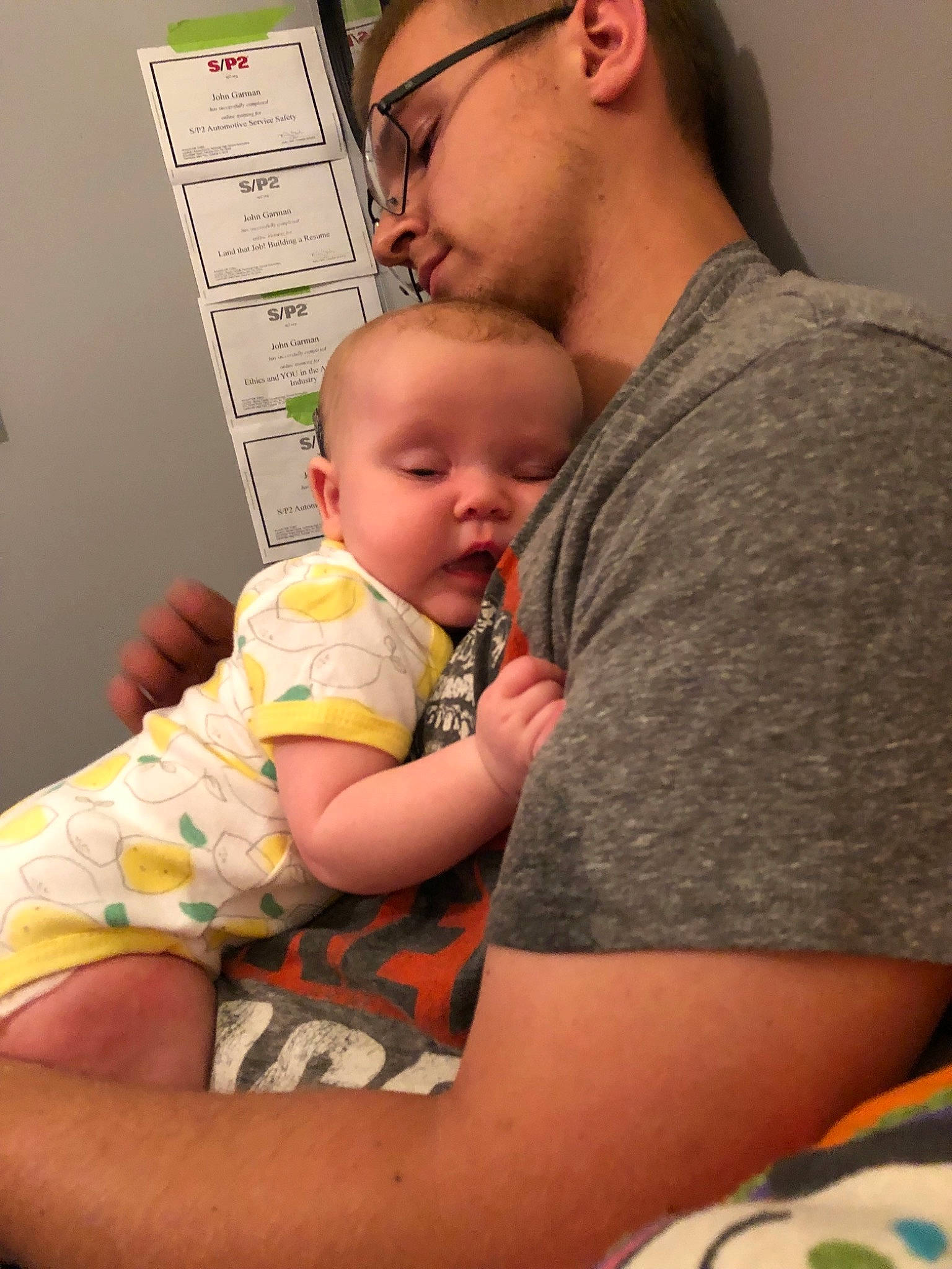 Annabelle is registered to the contest to win money with this photo: arm, baby, child, father, headwear, mother, person, skin, sleep, toddler