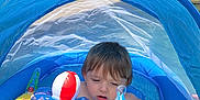 Ayden joined the competition — help win amazing prizes! toddler, child, inflatable_pool, yellow_float, blue_canopy, water, toy, outdoor, summer, sunlight, curious, baby, swimming, play, pool_toy, inflatable_toy, shade, young_child, summer_fun, recreation