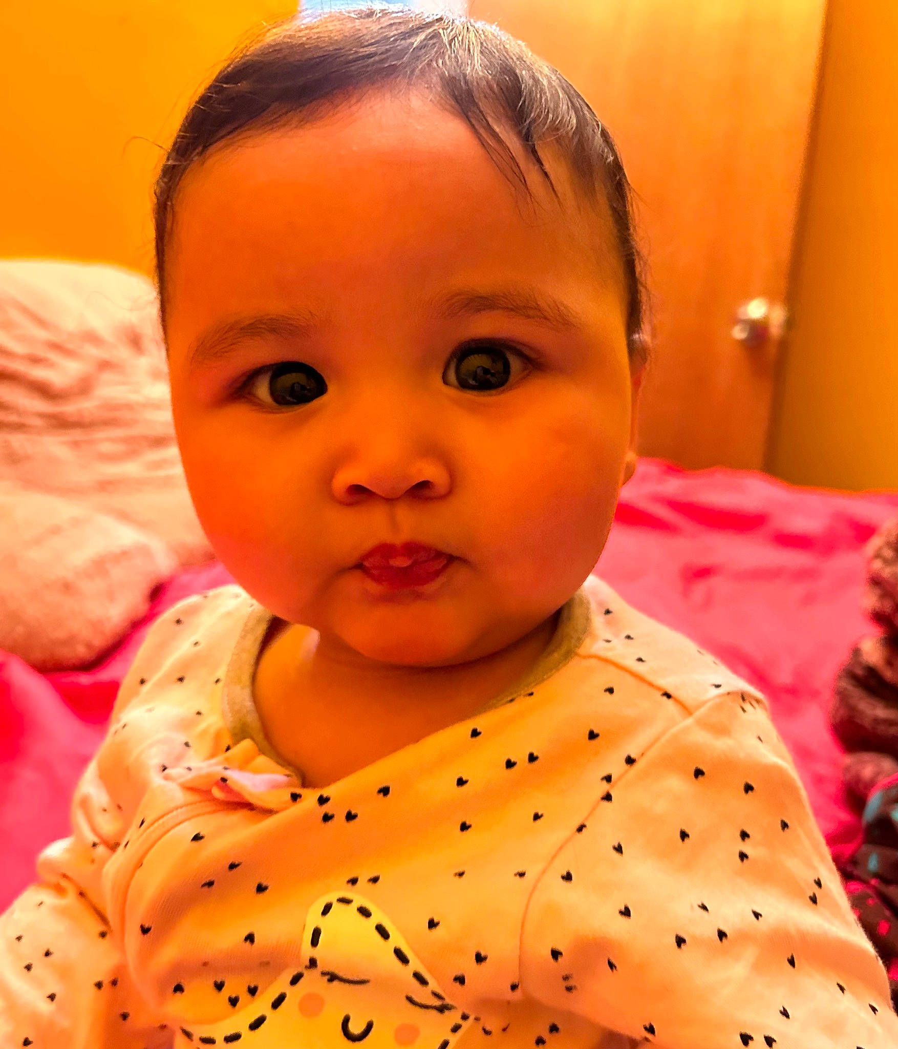Asiah is registered to the contest to win money with this photo: baby, baby_toddler_clothing, cheek, ear, eyebrow, eyelash, facial_expression, forehead, hair, happy, head, iris, lip, mouth, neck, nose, orange, person, skin, sleeve