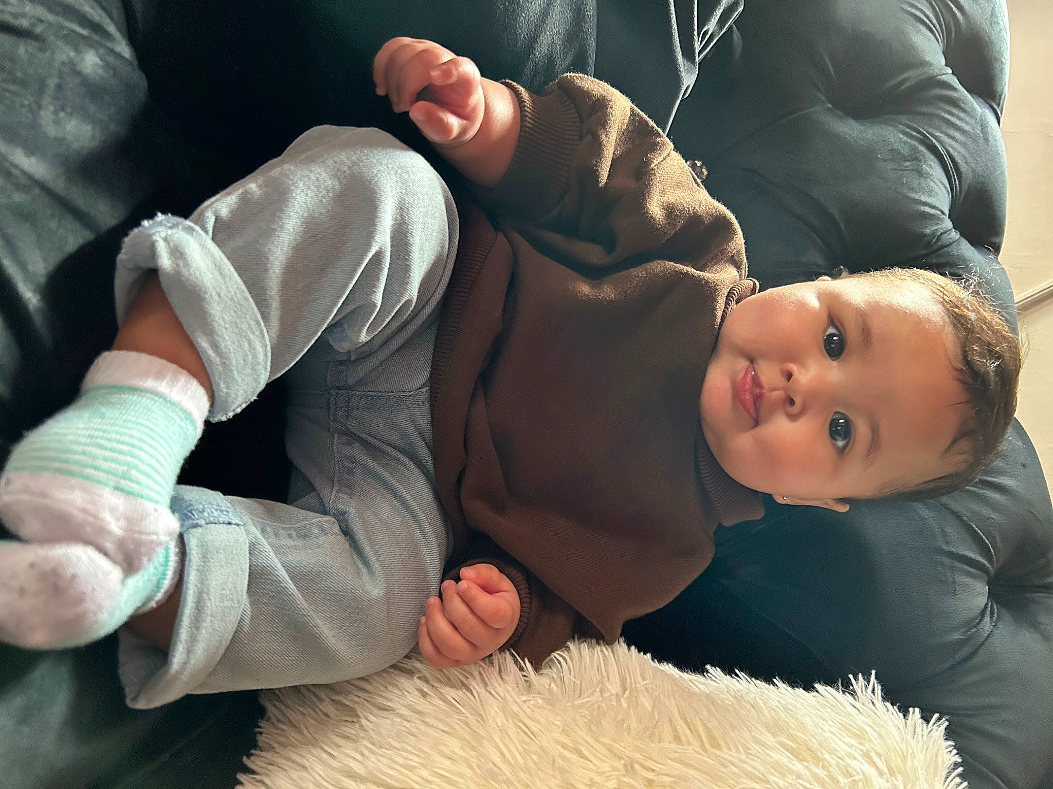 Asiah is registered to the contest to win money with this photo: abdomen, baby, child, comfort, elbow, fashion, flash_photography, fun, fur, gesture, grass, happy, human_body, human_leg, interaction, knee, leg, person, sitting, thigh