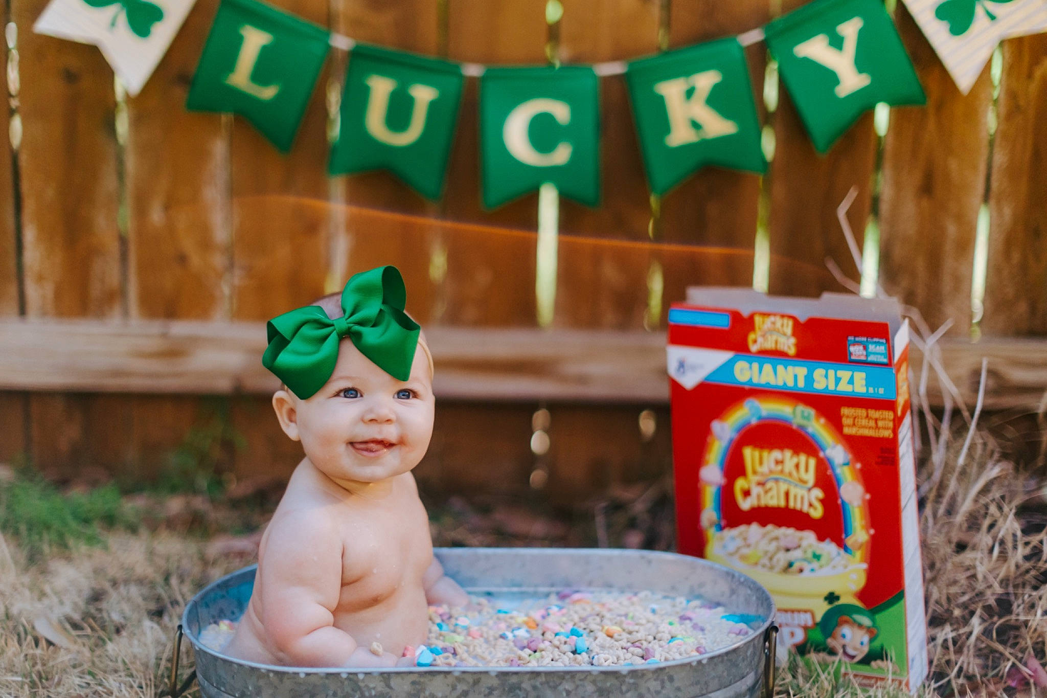 Katherine is registered to the contest to win money with this photo: baby, bathing, child, event, fictional_character, fun, grass, green, happy, headwear, holiday, joy, lawn_ornament, leisure, mammal, person, play, recreation, soil, toddler