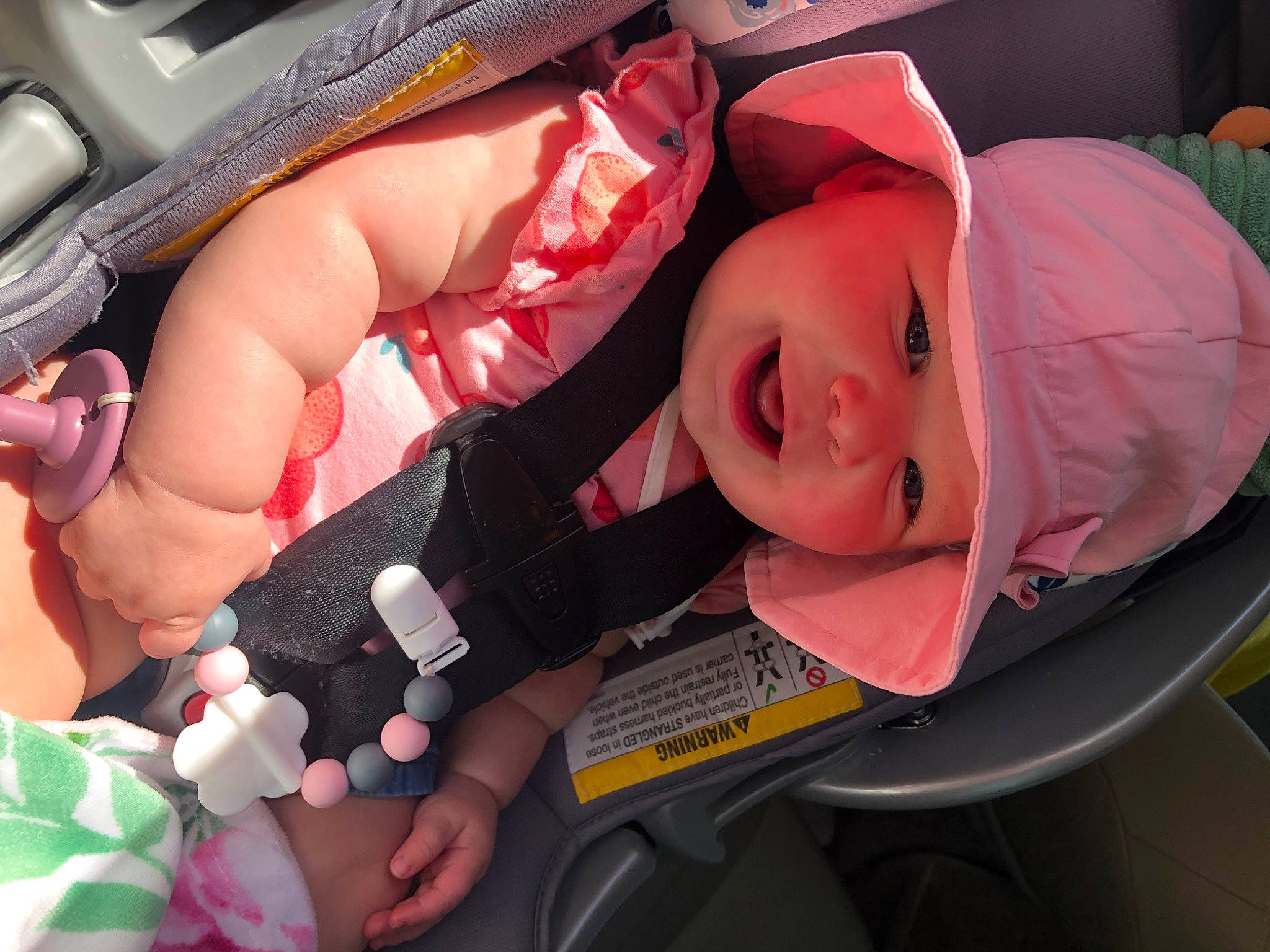 Katherine joined the competition — help win amazing prizes! auto_part, baby, baby_carriage, baby_products, car_seat, child, comfort, finger, fun, happy, hat, headwear, lap, mouth, nail, person, pink, product, skin, smile