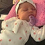 Everleigh joined the competition — help win amazing prizes! baby, newborn, sleeping, pacifier, pink_cushion, white_outfit, strawberry_print, headband, blanket, bed, infant, cute, resting, soft, cozy, indoor, child, clothing, peaceful, portrait