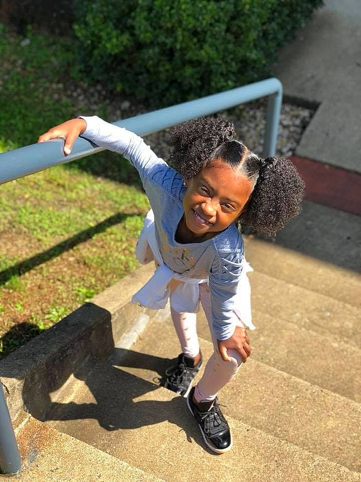 Emani is registered to the contest to win money with this photo: child, fun, joy, leisure, person, play, playground, smile, toddler, tree