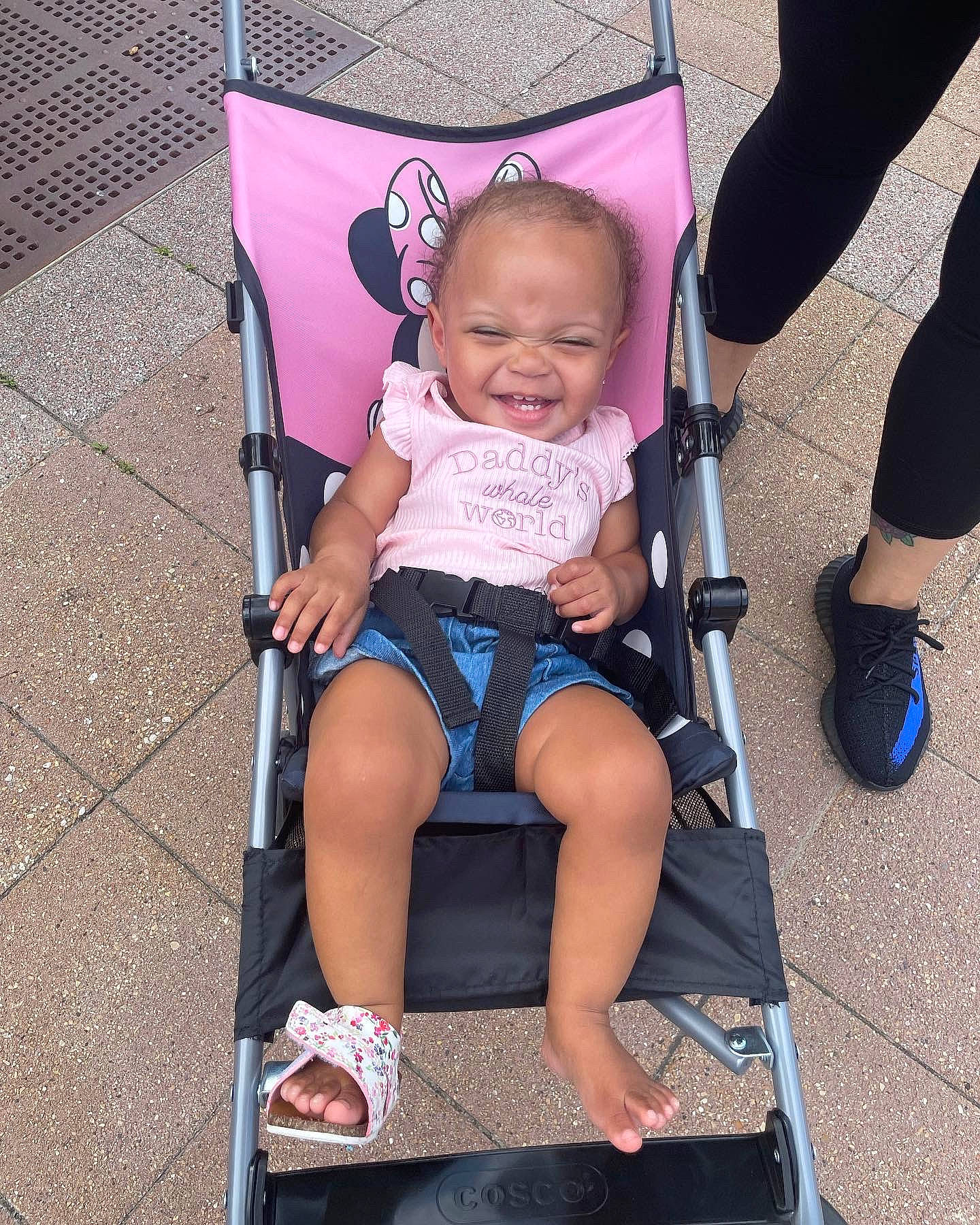 Kalani is registered to the contest to win money with this photo: baby, baby_carriage, baby_products, baby_toddler_clothing, child, comfort, electric_blue, face, fun, joy, lap, leg, magenta, person, product, shoe, smile, sneakers, tire, toddler