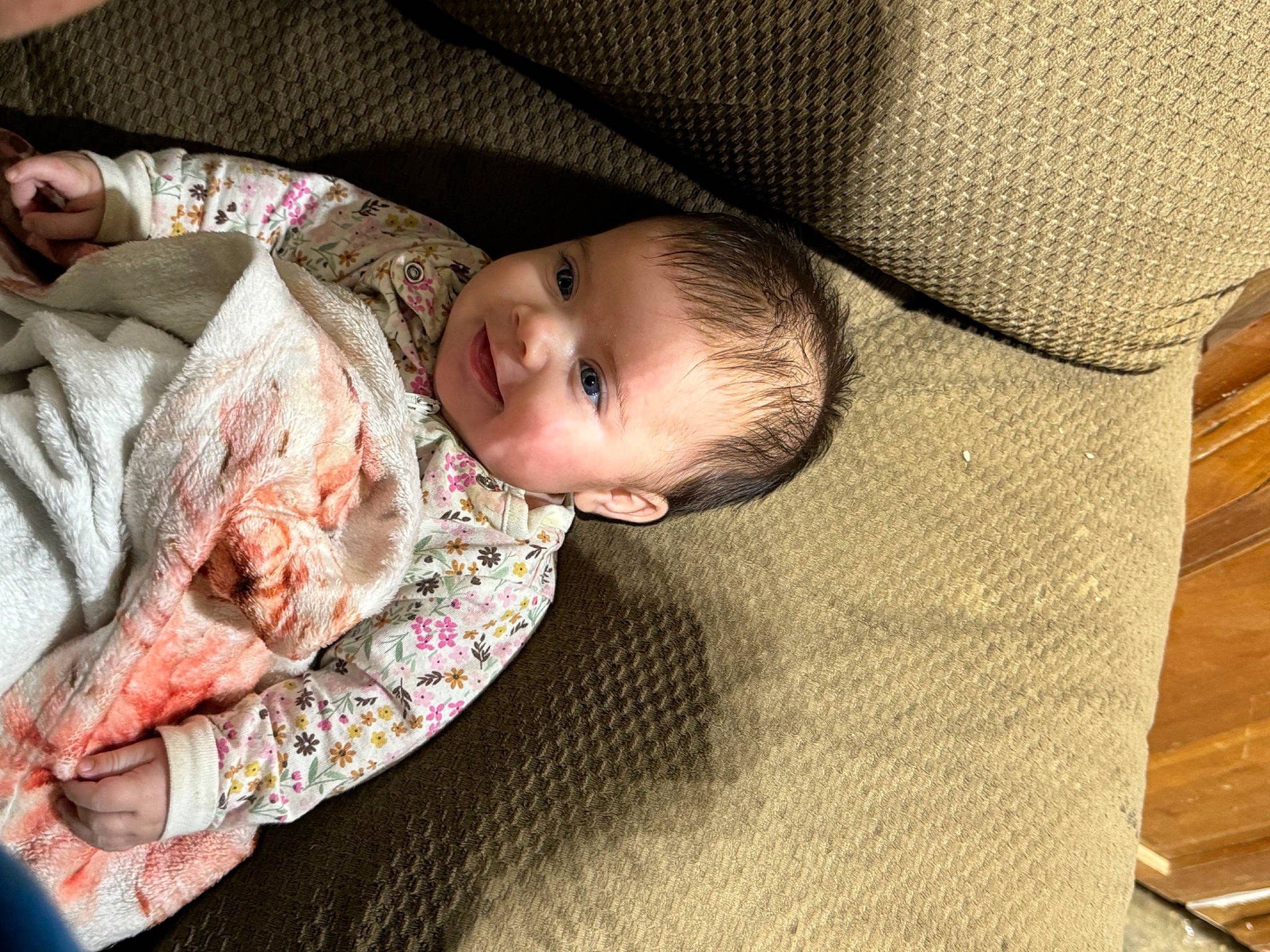 Oaklynn is registered to the contest to win money with this photo: baby, baby_products, baby_toddler_clothing, cheek, child, comfort, couch, eye, flooring, hardwood, head, linens, mammal, nap, person, room, sitting, skin, toddler, vertebrate
