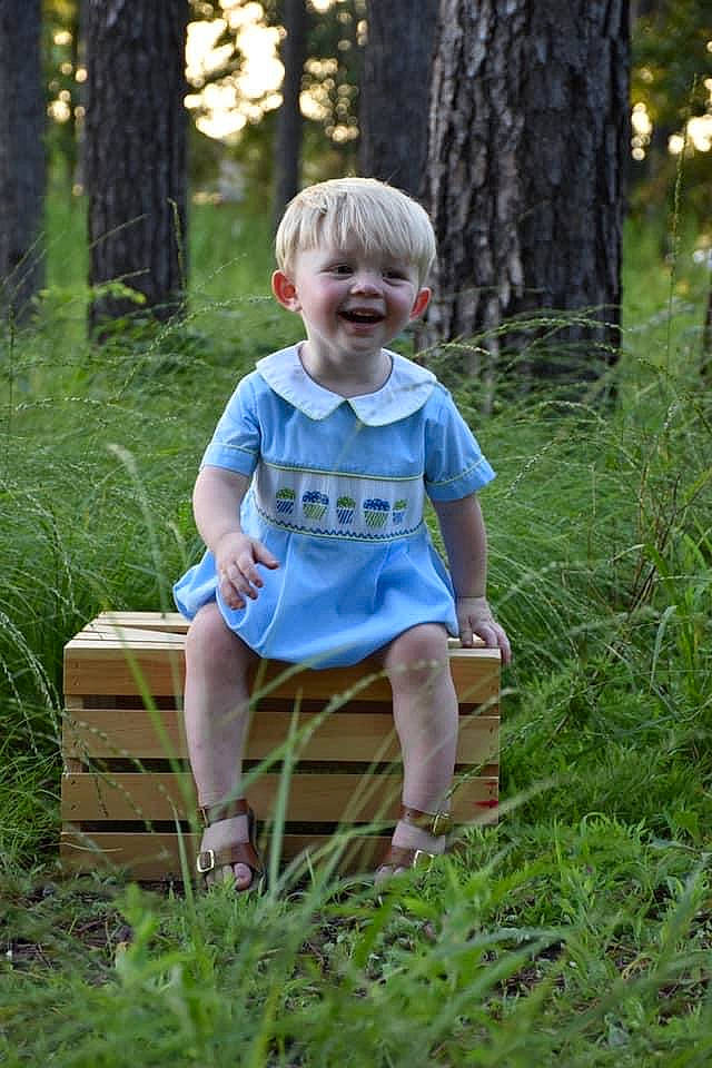 Sebastian joined the competition — help win amazing prizes! chair, eye, forest, fun, grass, happy, joy, leg, leisure, people_in_nature, person, plant, recreation, shorts, smile, summer, sunlight, t_shirt, terrestrial_plant, toddler