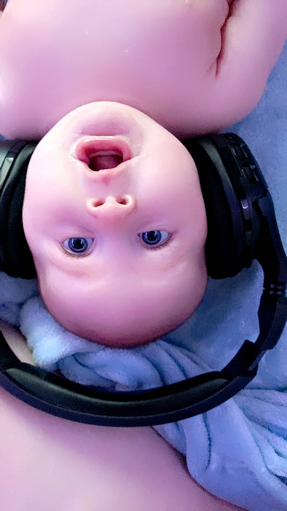 Pennelope is registered to the contest to win money with this photo: audio_equipment, cheek, child, circle, close_up, comfort, electric_blue, eyebrow, eyelash, fashion_accessory, flesh, headphones, headwear, magenta, material_property, nail, nose, person, pink, plastic