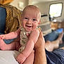 Naël a rejoint le concours — aidez-le/la à gagner de superbes lots ! baby, smiling, happy, child, infant, person, skin, arm, hand, foot, living_room, couch, blanket, blurred_background, holding, casual_clothing, indoor, portrait, cute, family