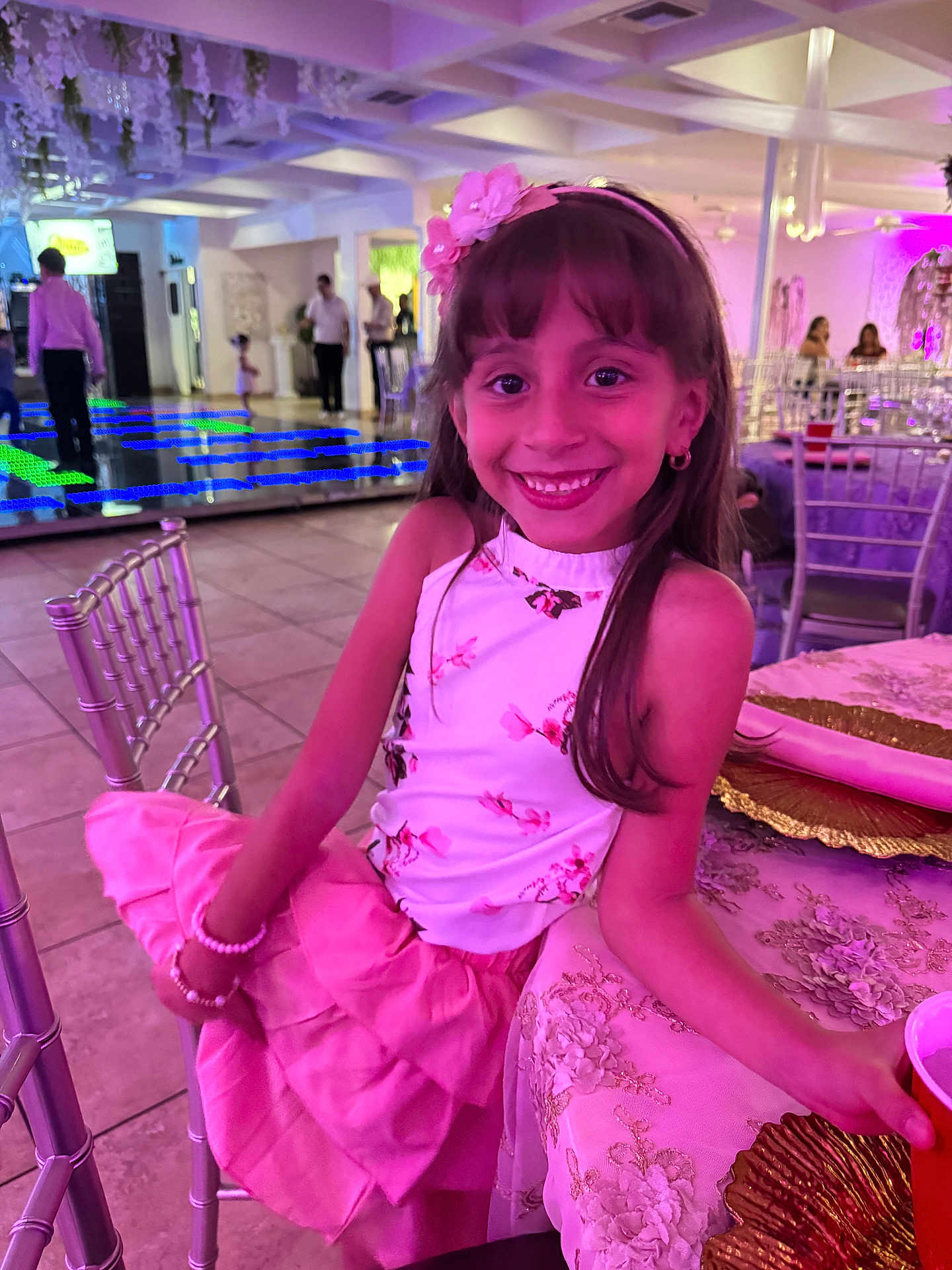 Rose Tuccino joined the competition — help win amazing prizes! child, girl, smile, party, dress, pink, white, bracelet, flower_headband, table, chair, cup, decor, lights, people, indoor, event, happy, portrait, celebration