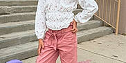 Rose Tuccino is registered to the contest to win money with this photo: child, girl, smile, posing, outdoor, stairs, concrete, backpack, clothing, white_shoes, pink_pants, long_hair, school, railing, building, sidewalk, casual, happy, young, accessories