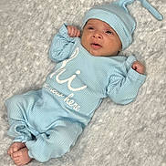 Max joined the competition — help win amazing prizes! baby, infant, blue_clothing, onesie, hat, soft_blanket, lying_down, newborn, cute, tiny_feet, fist, ribbed_fabric, cozy, indoor, portrait, child, sleepwear, headwear, expression, skin