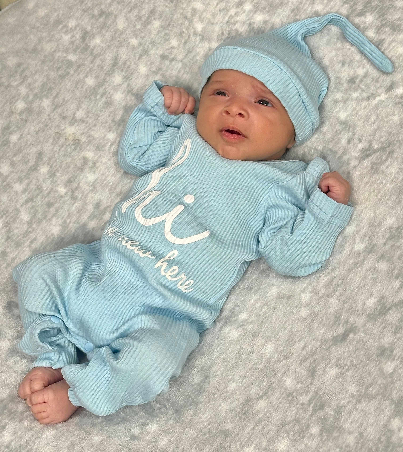 Max joined the competition — help win amazing prizes! baby, infant, blue_clothing, onesie, hat, soft_blanket, lying_down, newborn, cute, tiny_feet, fist, ribbed_fabric, cozy, indoor, portrait, child, sleepwear, headwear, expression, skin