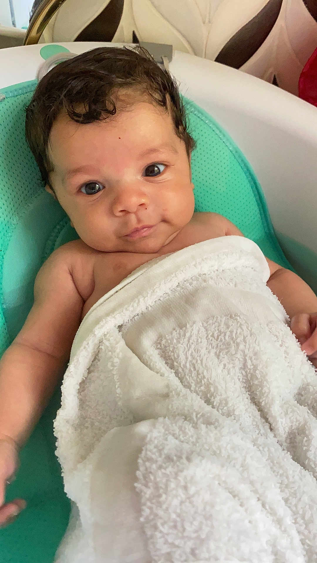 Travis is registered to the contest to win money with this photo: baby, infant, towel, seat, cute, child, skin, face, eyes, hair, arm, hand, expression, indoor, comfort, soft, relaxation, person, portrait, newborn