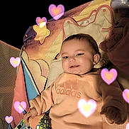 Talya participe au concours pour gagner de l'argent avec cette photo : adidas, baby, blanket, casual, child, clothing, comfort, cute, happy, heart_effects, indoor, infant, orange, person, pink, playpen, portrait, smile, soft_lighting, toy