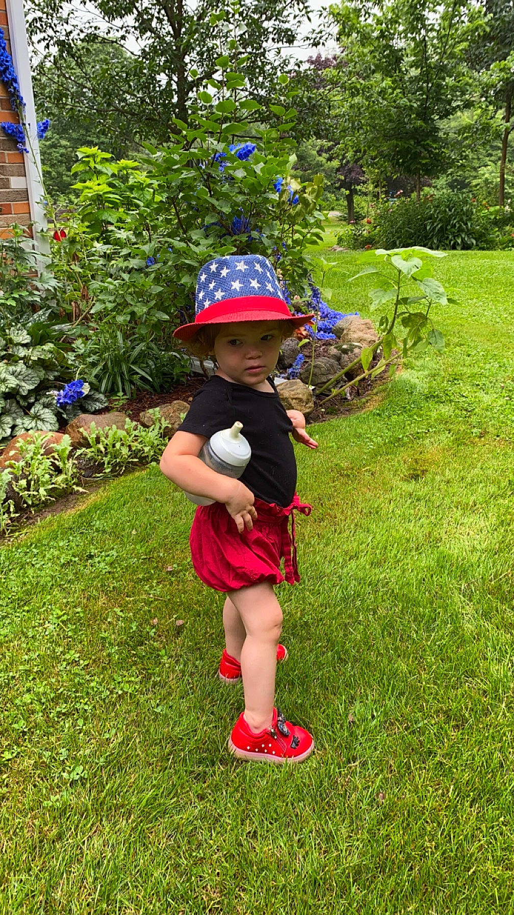 Briar is registered to the contest to win money with this photo: baby, garden, gardening, grass, groundcover, headwear, landscape, landscaping, lawn, lawn_ornament, leisure, people_in_nature, person, personal_protective_equipment, plant, recreation, sandal, shorts, shrub, terrestrial_plant