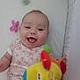 Meryl a rejoint le concours — aidez-le/la à gagner de superbes lots ! baby, bed, child, colorful, crib, cute, face, happy, indoor, infant, mouth_open, onesie, pacifier, person, plush_toy, sleeping_area, smiling, soft, tongue_out, toy