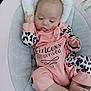 Meryl a rejoint le concours — aidez-le/la à gagner de superbes lots ! baby, baby_seat, child, cushion, cute, face, foot, hand, indoors, infant, leopard_print, newborn, onesie, person, pink_clothing, relaxed, resting, sleepwear, small_feet, soft