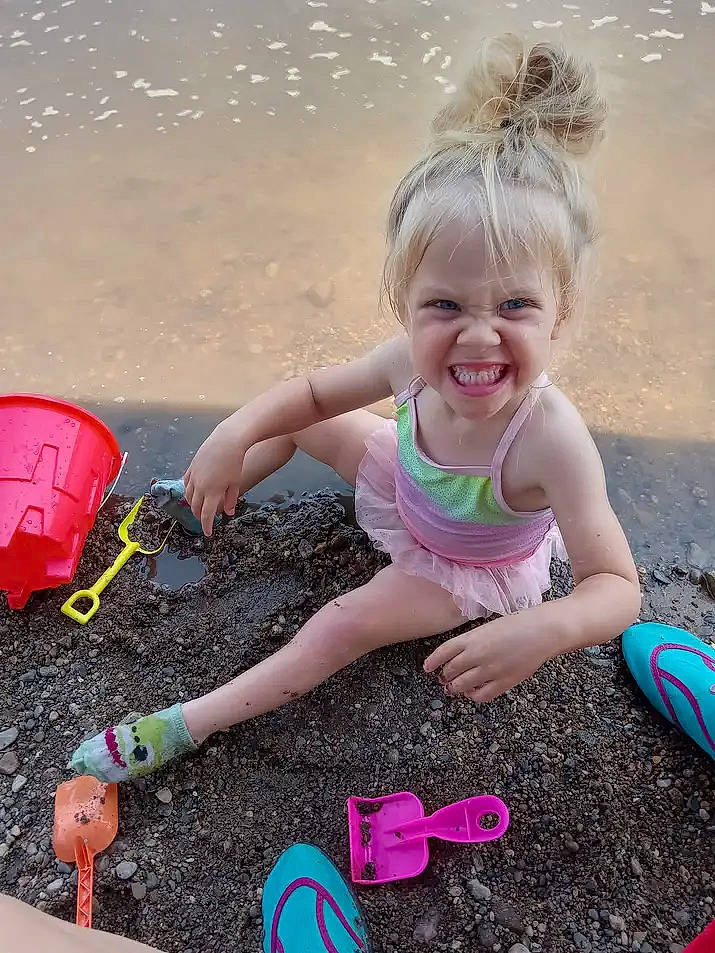 Juniper is registered to the contest to win money with this photo: beach, beauty, child, facial_expression, fun, happy, joy, leisure, magenta, morning, people, people_in_nature, people_on_beach, person, photograph, pink, sand, smile, snapshot, summer