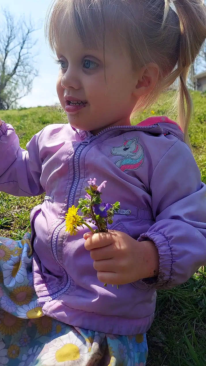 Juniper joined the competition — help win amazing prizes! arm, baby_toddler_clothing, child, finger, flower, garden, gesture, grass, hand, happy, iris, meadow, people_in_nature, person, pink, plant, play, purple, sleeve, toddler