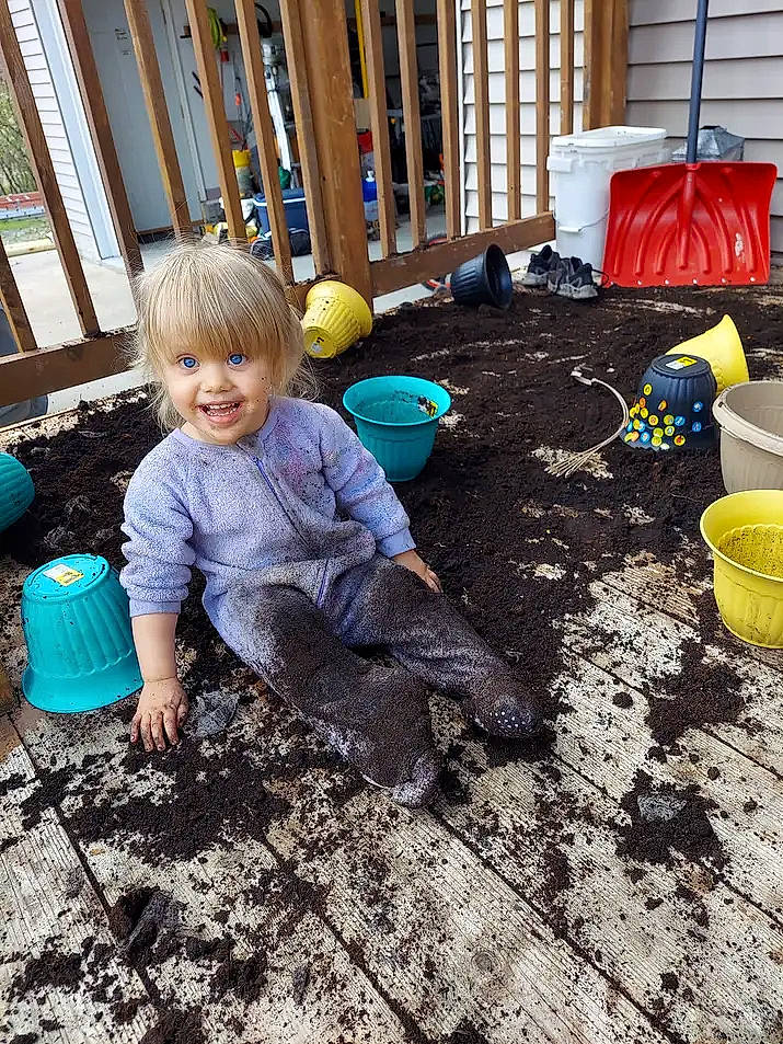Juniper joined the competition — help win amazing prizes! backyard, child, flooring, fun, garden, grass, leisure, outdoor_play_equipment, people, people_in_nature, person, play, recreation, road_surface, sitting, smile, soil, toddler, toy, wood