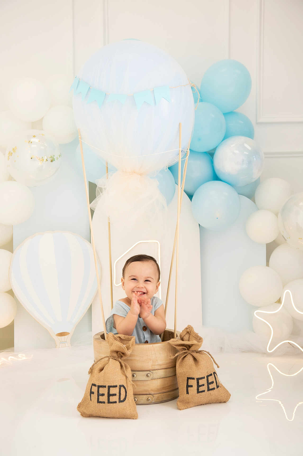 Nicolas Asafe joined the competition — help win amazing prizes! baby, child, smiling, balloons, blue, white, hot_air_balloon, barrel, burlap_sacks, feed, celebration, decorations, indoor, cute, happy, neon_light, star_shape, playful, portrait, tulle