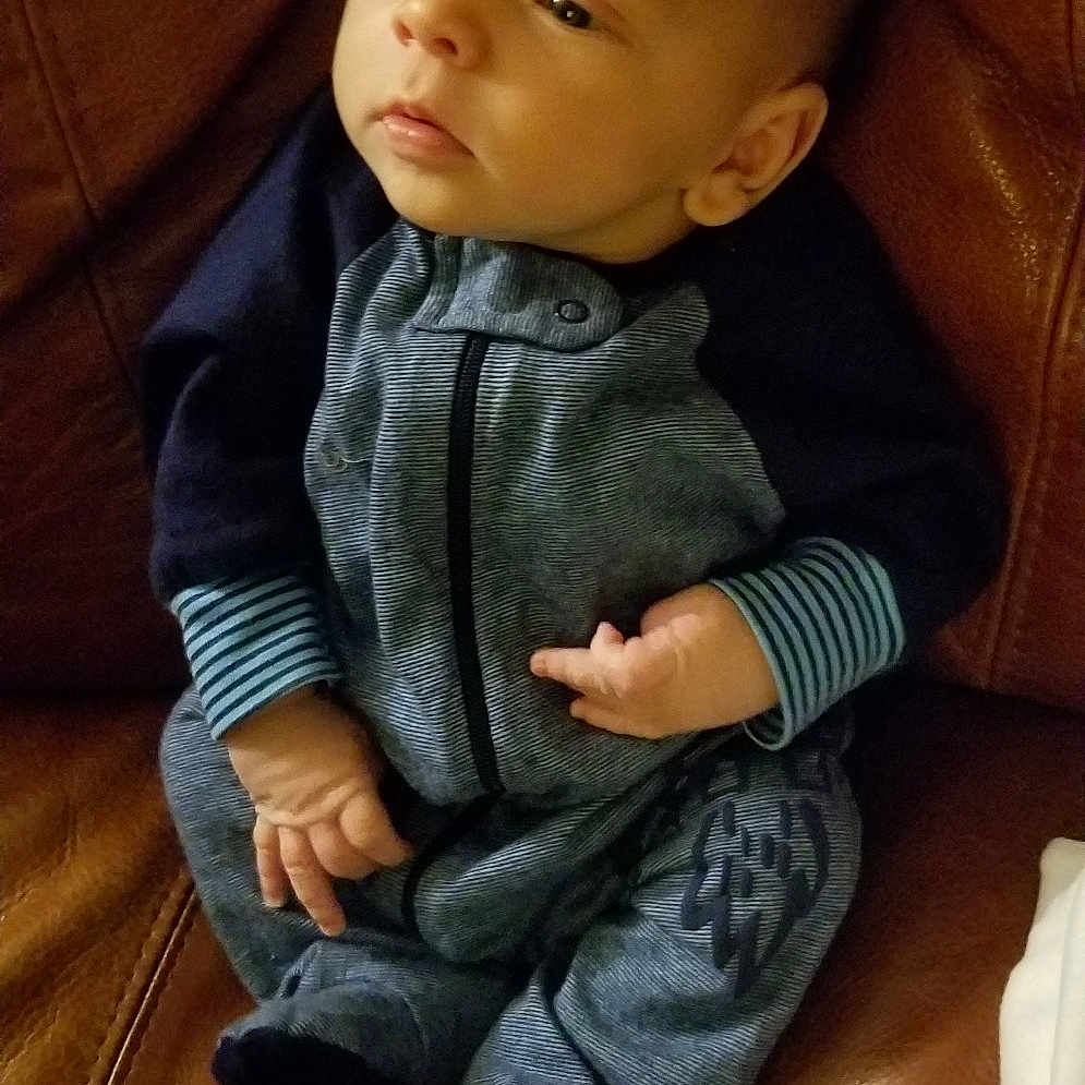 Nickolas is registered to the contest to win money with this photo: child, infant, person, sitting, toddler