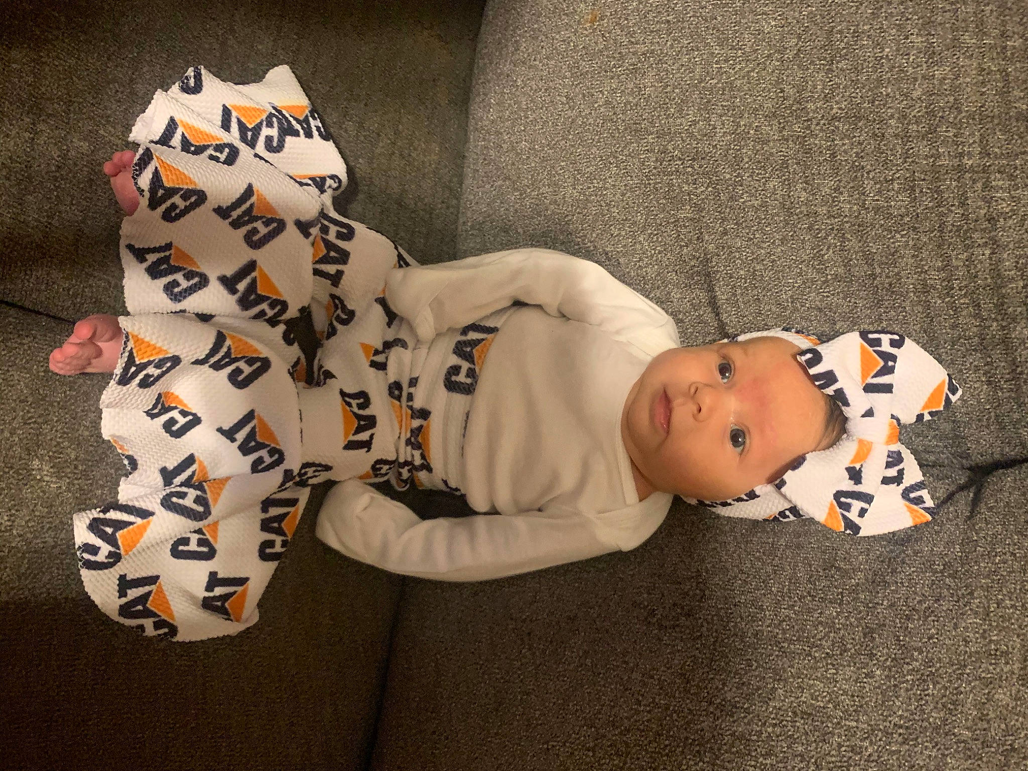 Elizabeth is registered to the contest to win money with this photo: baby, baby_toddler_clothing, carmine, child, comfort, face, facial_expression, felidae, headgear, mammal, pattern, person, sleeve, stuffed_toy, tail, terrestrial_animal, textile, toddler, toy, vertebrate