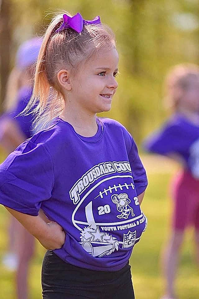 Makenna joined the competition — help win amazing prizes! athlete, blond, brown_hair, child, competition_event, electric_blue, facial_expression, fun, grass, hairstyle, happy, headpiece, joy, person, player, purple, recreation, smile, sports, sportswear