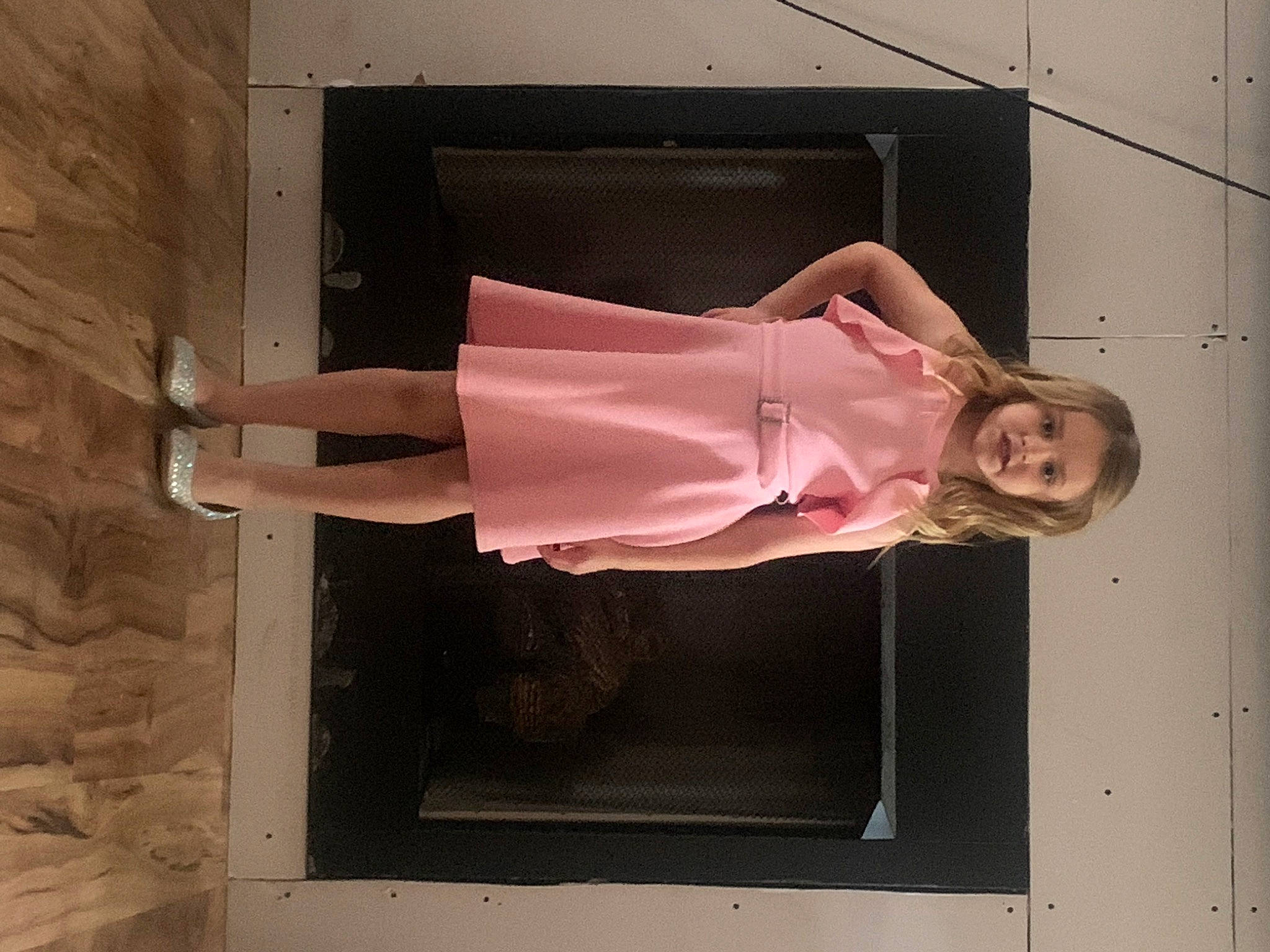 Makenna is registered to the contest to win money with this photo: arm, building, dress, fashion_design, footwear, hand, high_heels, human_leg, leg, one_piece_garment, person, rectangle, shoe, sleeve, smile, street_fashion, thigh, tints_and_shades, vintage_clothing, waist