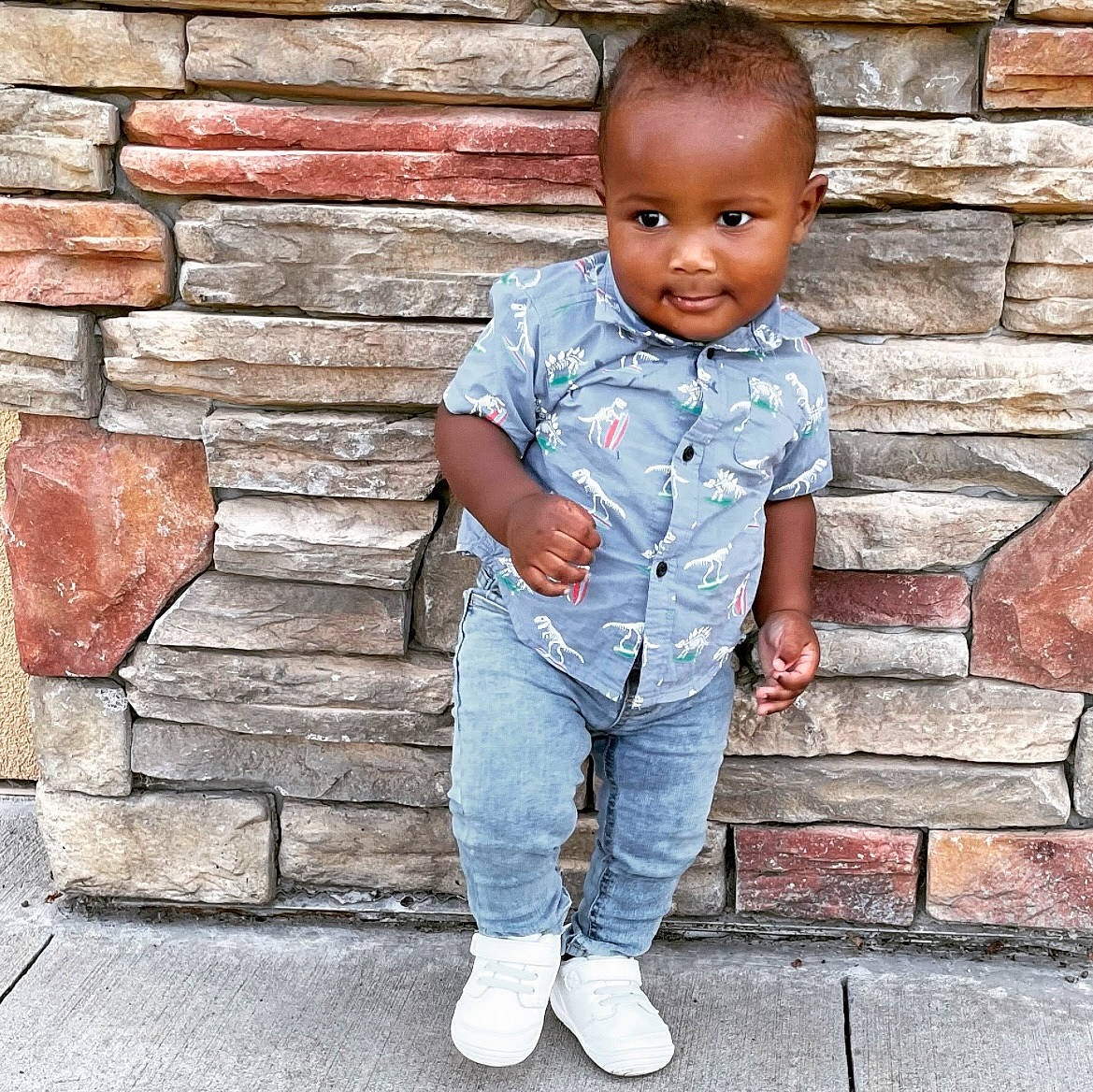 Bryson is registered to the contest to win money with this photo: baby_toddler_clothing, brick, brickwork, chin, clothing, denim, door, dress_shirt, electric_blue, eye, flash_photography, hair, happy, head, jeans, person, photograph, sleeve, standing, t_shirt