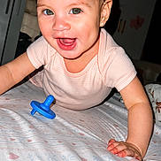 Nyelle joined the competition — help win amazing prizes! baby, child, crawling, smiling, bed, pacifier, indoor, person, clothing, face, happy, cute, infant, young_child, human, hands, head, expression, eyes, skin