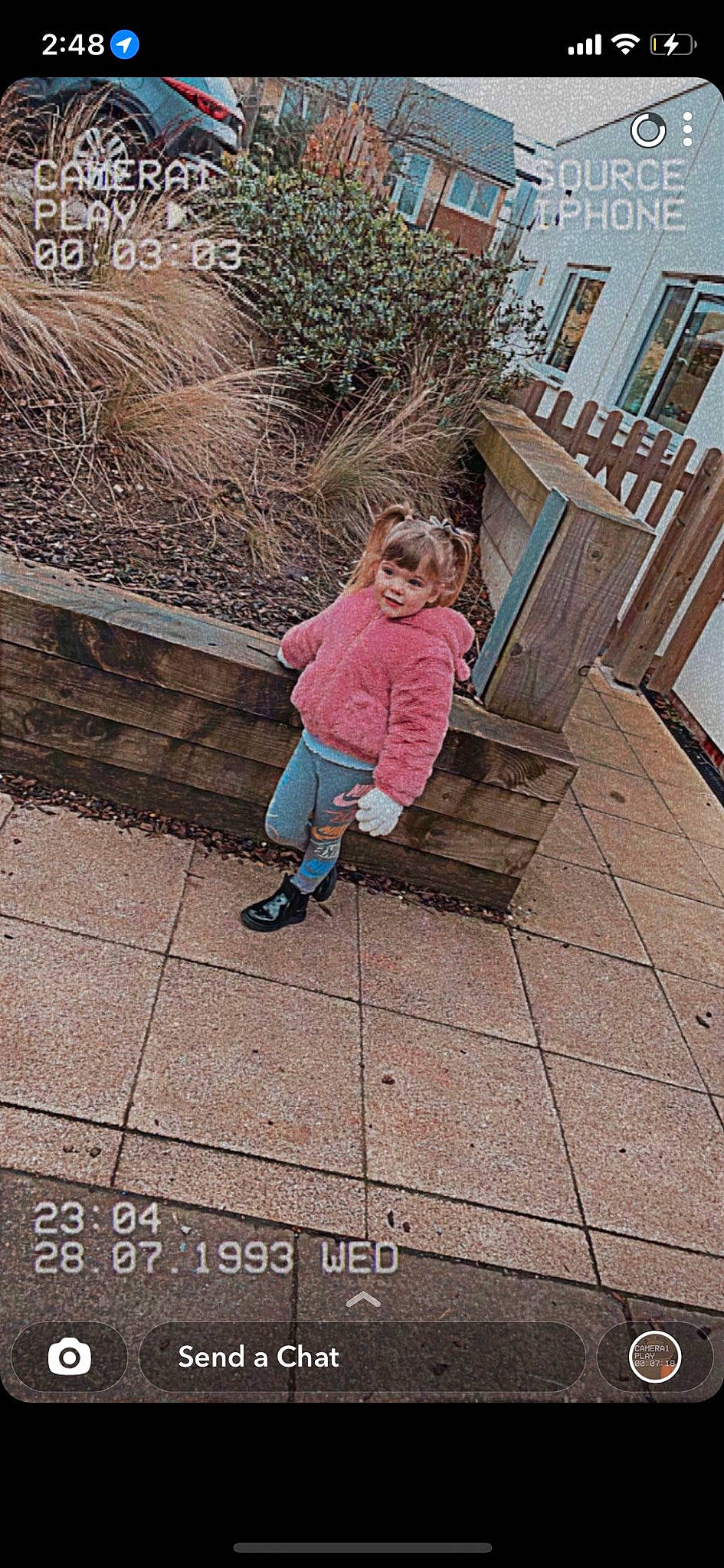 Maisie is registered to the contest to win money with this photo: asphalt, city, cobblestone, flooring, footwear, grass, house, human_leg, joy, leg, leisure, pedestrian, person, road_surface, sidewalk, tints_and_shades, toddler, tree, walkway, wall