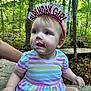 Azelia Lynn joined the competition — help win amazing prizes! toddler, birthday_girl, headband, cake_frosting, striped_dress, outdoor, forest, child, cute, sitting, hand, face, nature, celebration, young_child, person, happy, event, food, closeup