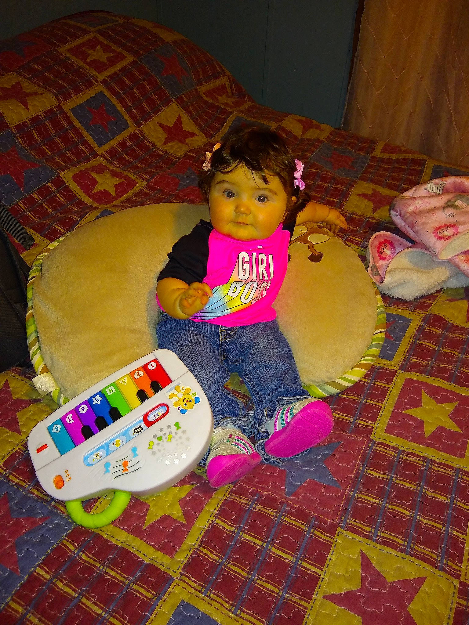 Azaria is registered to the contest to win money with this photo: baby, baby_products, baby_toddler_clothing, baby_toys, child, comfort, couch, floor, flooring, fun, lap, magenta, pattern, person, play, room, sitting, sock, toddler, toy