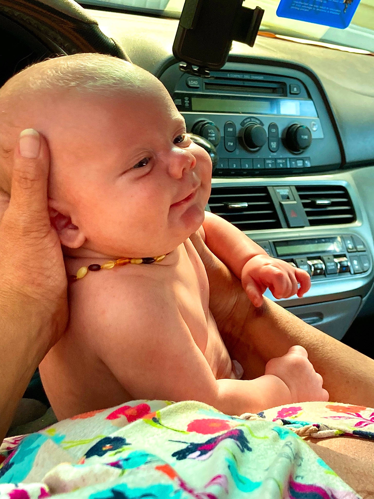Axle is registered to the contest to win money with this photo: baby, car, finger, fun, gear_shift, hand, happy, mammal, mouth, muscle, nose, person, product, radio, satellite_radio, skin, smile, steering_wheel, thumb, toddler