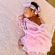 Eliora participe au concours pour gagner de l'argent avec cette photo : baby, sleeping, pink, lace, tutu, headband, flower, blanket, soft, newborn, cute, infant, portrait, cozy, wooden_floor, child, resting, clothing, delicate, peaceful