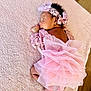 baby, sleeping, pink, lace, tutu, headband, flower, blanket, soft, newborn, cute, infant, portrait, cozy, wooden_floor, child, resting, clothing, delicate, peaceful