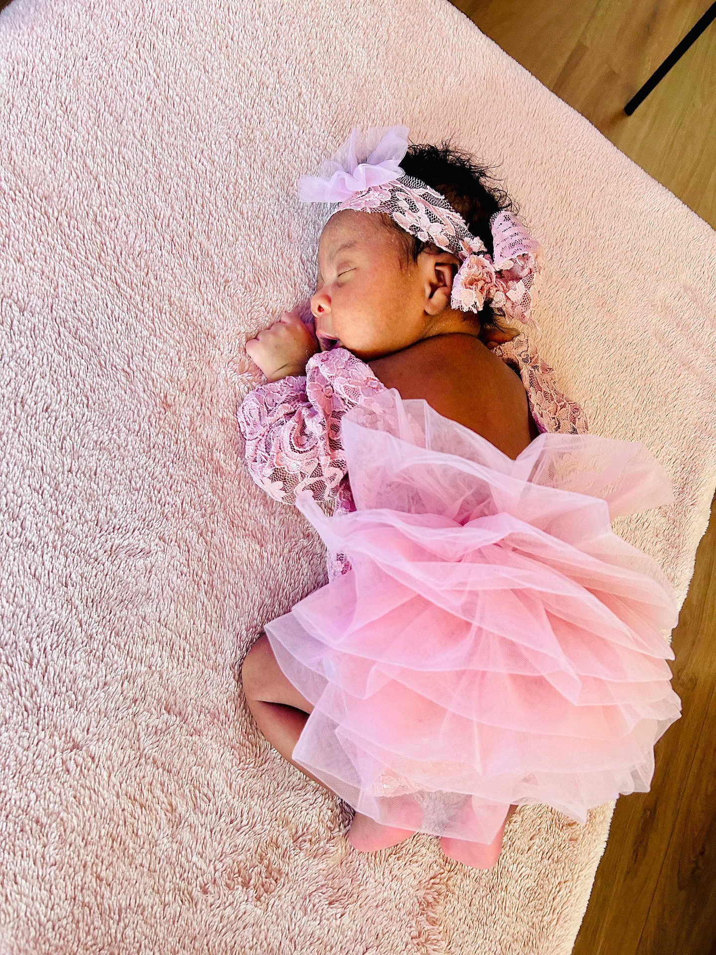 Eliora participe au concours pour gagner de l'argent avec cette photo : baby, sleeping, pink, lace, tutu, headband, flower, blanket, soft, newborn, cute, infant, portrait, cozy, wooden_floor, child, resting, clothing, delicate, peaceful