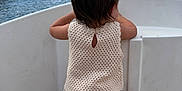 Ghjulia participe au concours pour gagner de l'argent avec cette photo : back_view, barefoot, boat, buildings, child, clouds, crocheted_clothing, cute, hair_ponytail, harbor, marina, outdoor, peaceful, sailboat, sky, strawberry_patch, summer, toddler, vacation, water