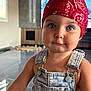 Ghjulia a rejoint le concours — aidez-le/la à gagner de superbes lots ! baby, bandana, blue_eyes, child, clothing, curious, cute, denim_overalls, face, headwear, indoor, living_room, modern_interior, person, portrait, red_bandana, skin, smile, television, toddler