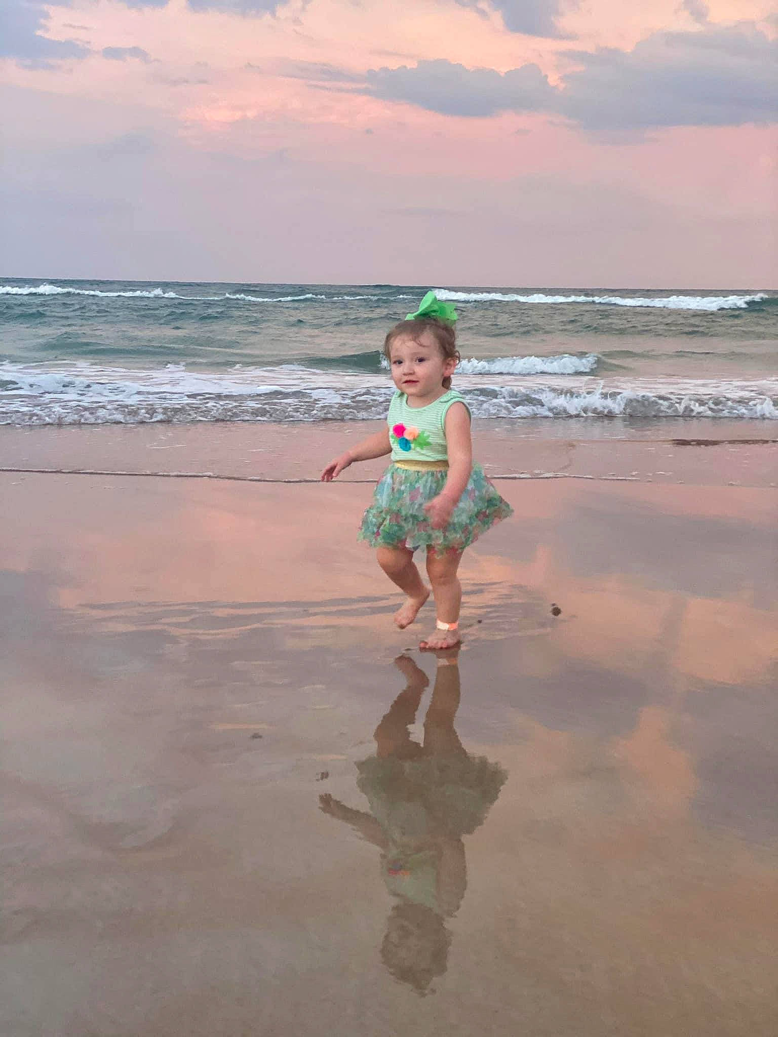 Bailee is registered to the contest to win money with this photo: beach, child, coast, coastal_and_oceanic_landforms, fun, ocean, person, photography, play, sand, sea, shore, sky, summer, tide, toddler, tropics, vacation, water, wave