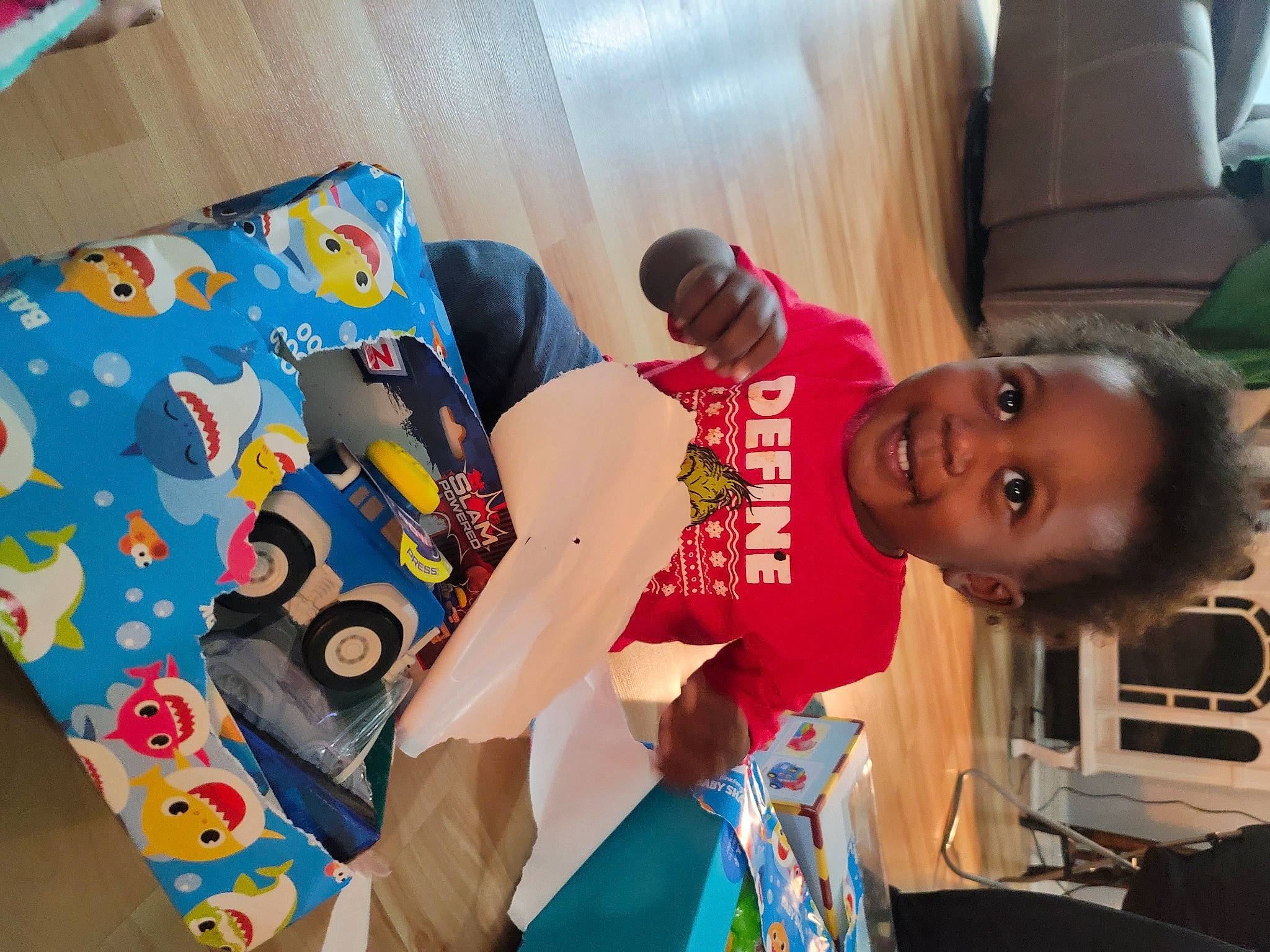 Kassius is registered to the contest to win money with this photo: bedding, child, comfort, couch, event, fun, happy, hat, joy, leisure, linens, pattern, person, play, room, smile, t_shirt, toddler, visual_arts