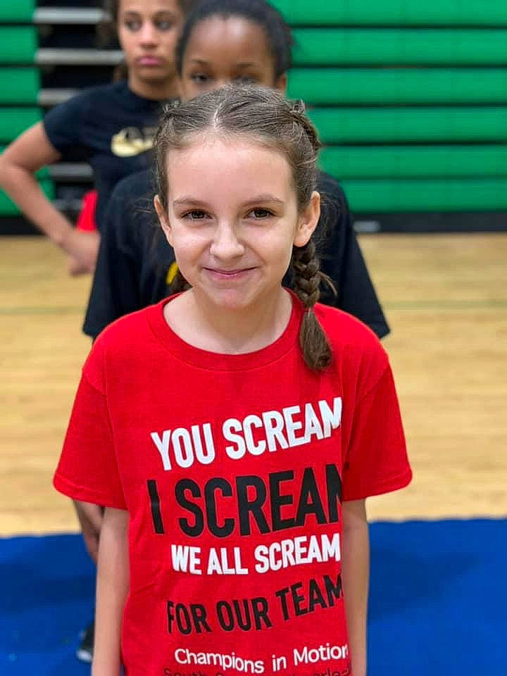 Malaya is registered to the contest to win money with this photo: athlete, blue, child, competition_event, electric_blue, event, fun, happy, headwear, joy, leisure, mammal, person, player, recreation, sleeve, smile, sports, sportswear, t_shirt