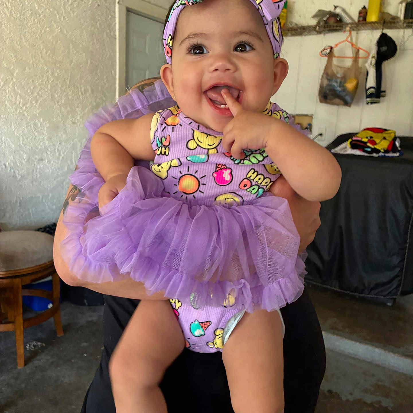 Deyalynn joined the competition — help win amazing prizes! baby, child, clothing, cute, diaper, door, fingers, furniture, hand, happy, headband, indoor, person, playful, purple, sitting, smiling, sock, tutu, wall