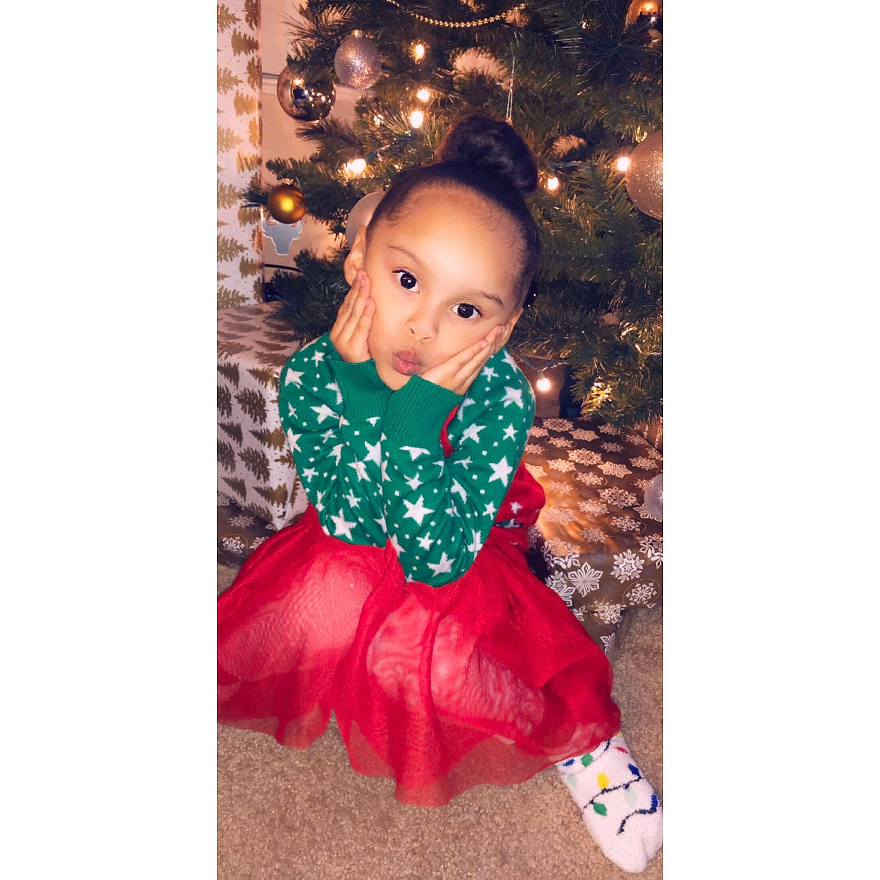 Azylah joined the competition — help win amazing prizes! brown_hair, child, child_model, christmas, christmas_eve, christmas_tree, clothing, costume, doll, dress, head, holiday, outerwear, pattern, person, shoe, sleeve, toddler