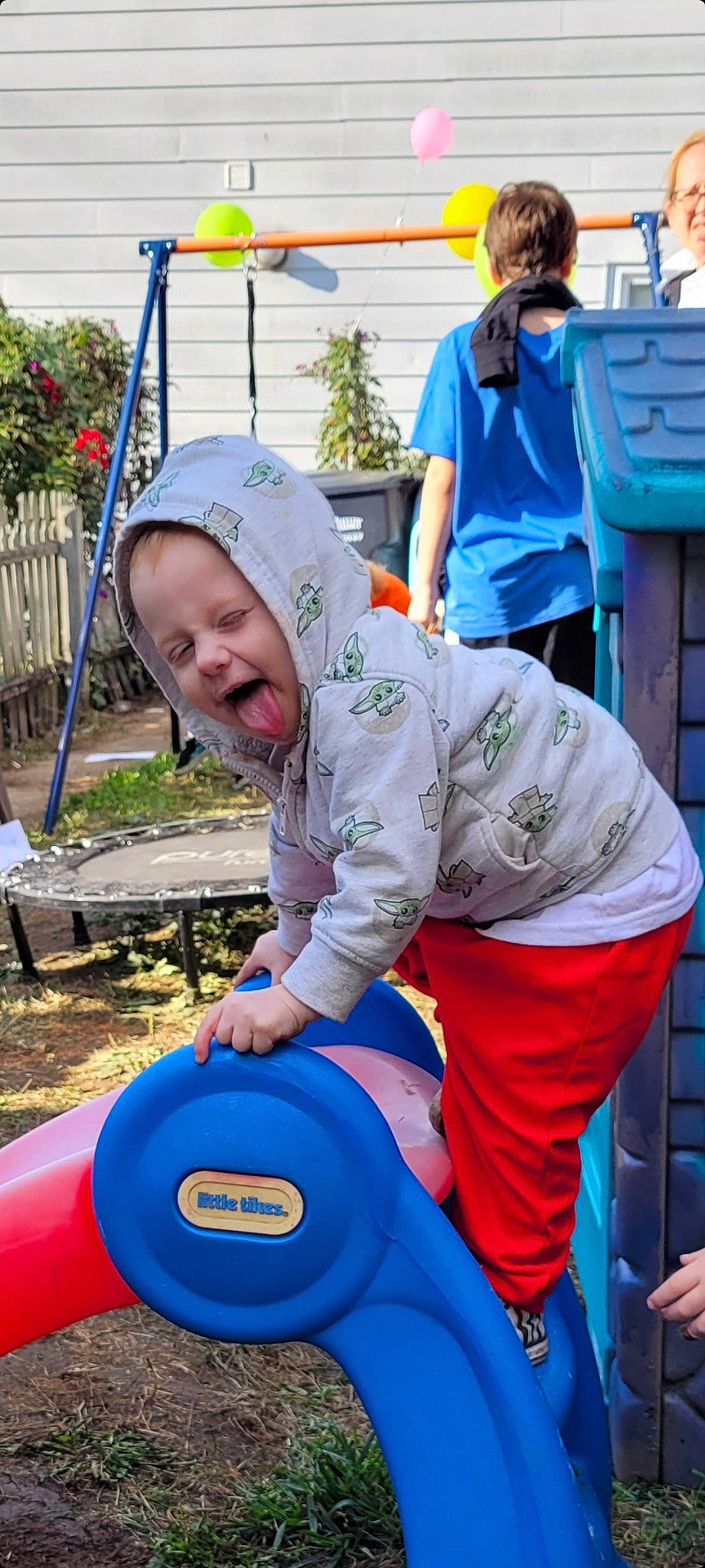 River joined the competition — help win amazing prizes! blue, child, electric_blue, event, flag, fun, inflatable, leisure, outdoor_play_equipment, person, plant, plastic, play, playground, recreation, sitting, smile, soil, t_shirt, toddler