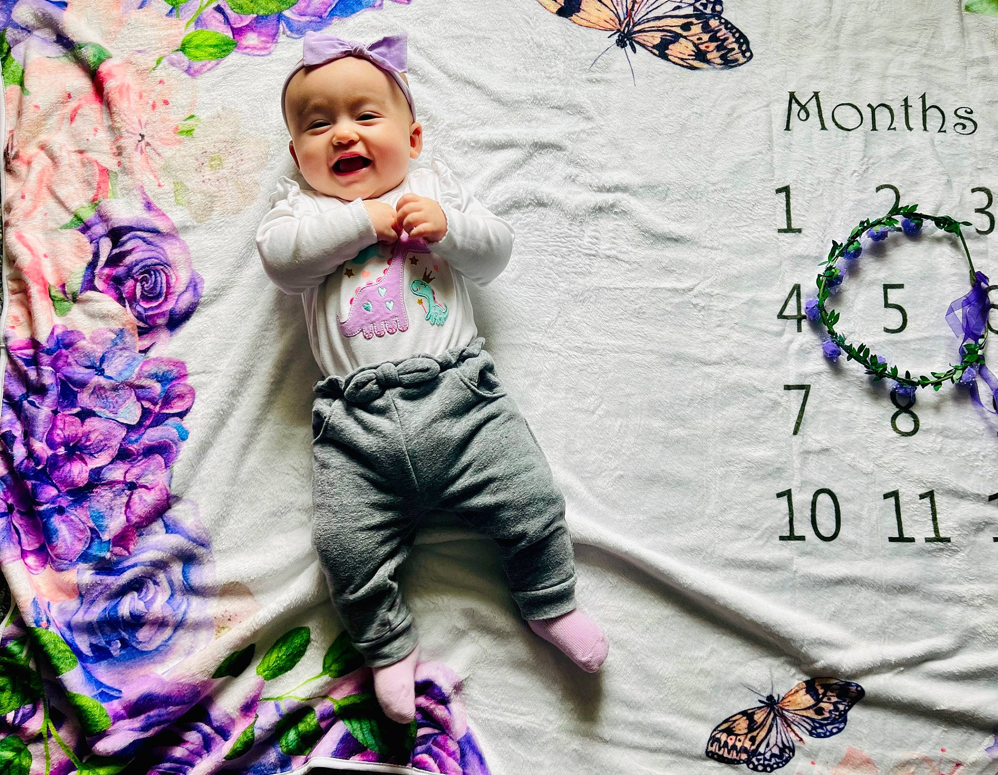 Julia is registered to the contest to win money with this photo: art, arthropod, child, design, fictional_character, font, fun, green, happy, headwear, insect, magenta, organism, pattern, people_in_nature, person, photograph, pink, pollinator, smile